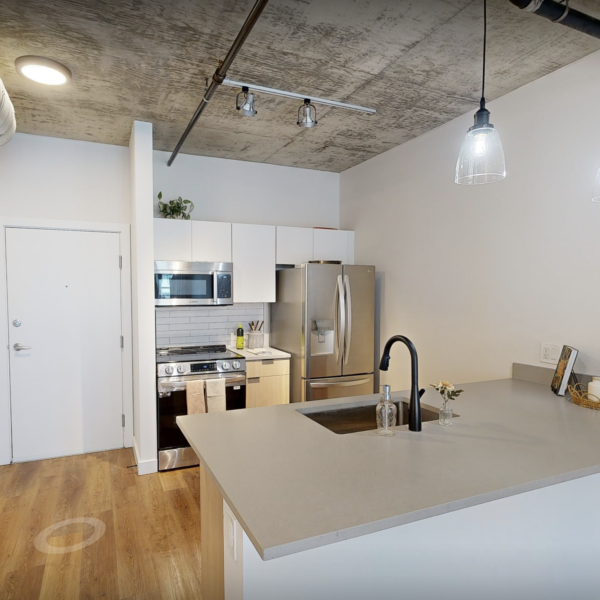 Interior of Lincoln Floor Plan facing Kitchen island with overhead lights